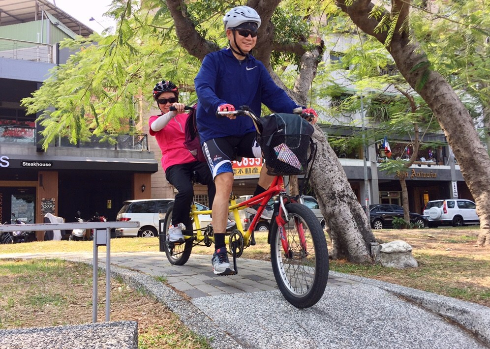 Couple riding on a Tandam Bike