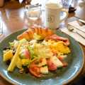 Croissant with Tomato, Mozzarella, Ham, Scrambled Eggs, Potatos and Salad