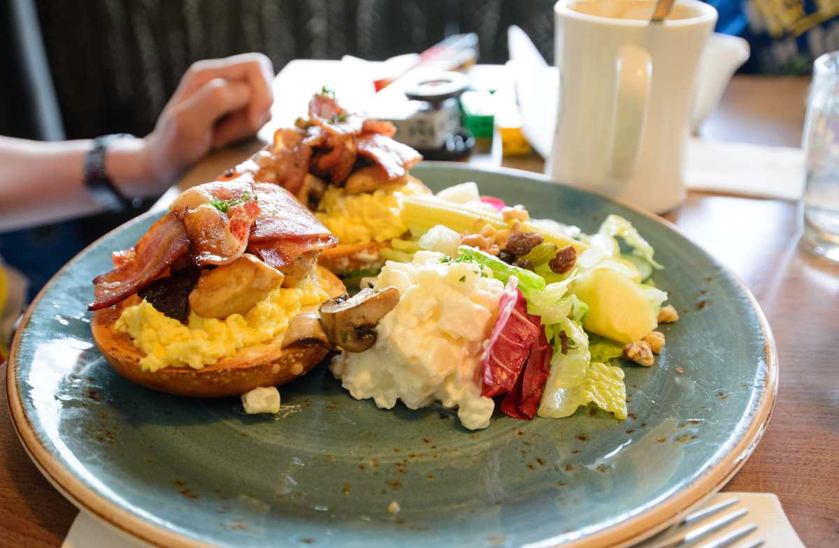 Scrambled Eggs with Bagel, Bacon, Mushroom, Potato and Salad