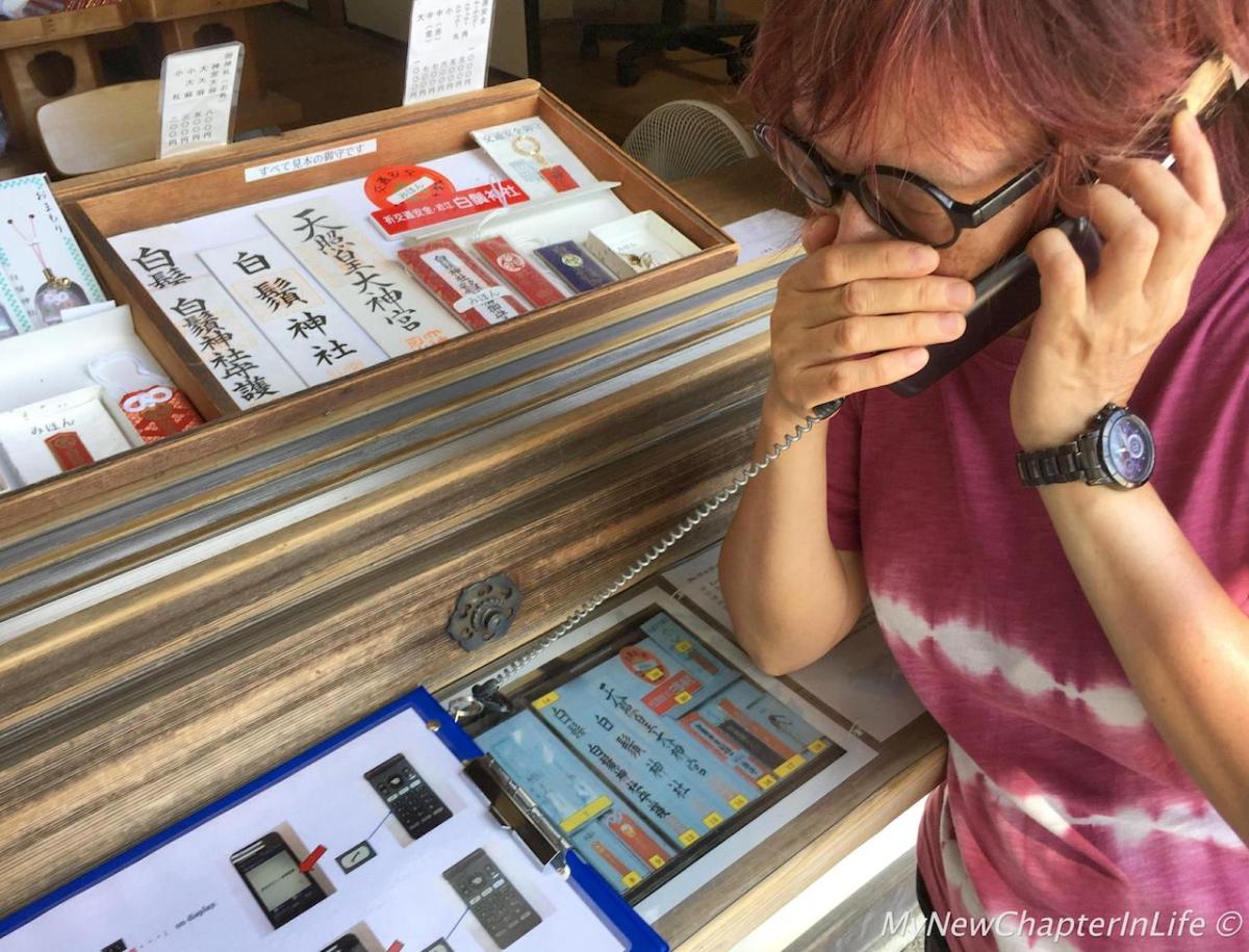 My wife calling taxi to Omi-Takashima JR Station