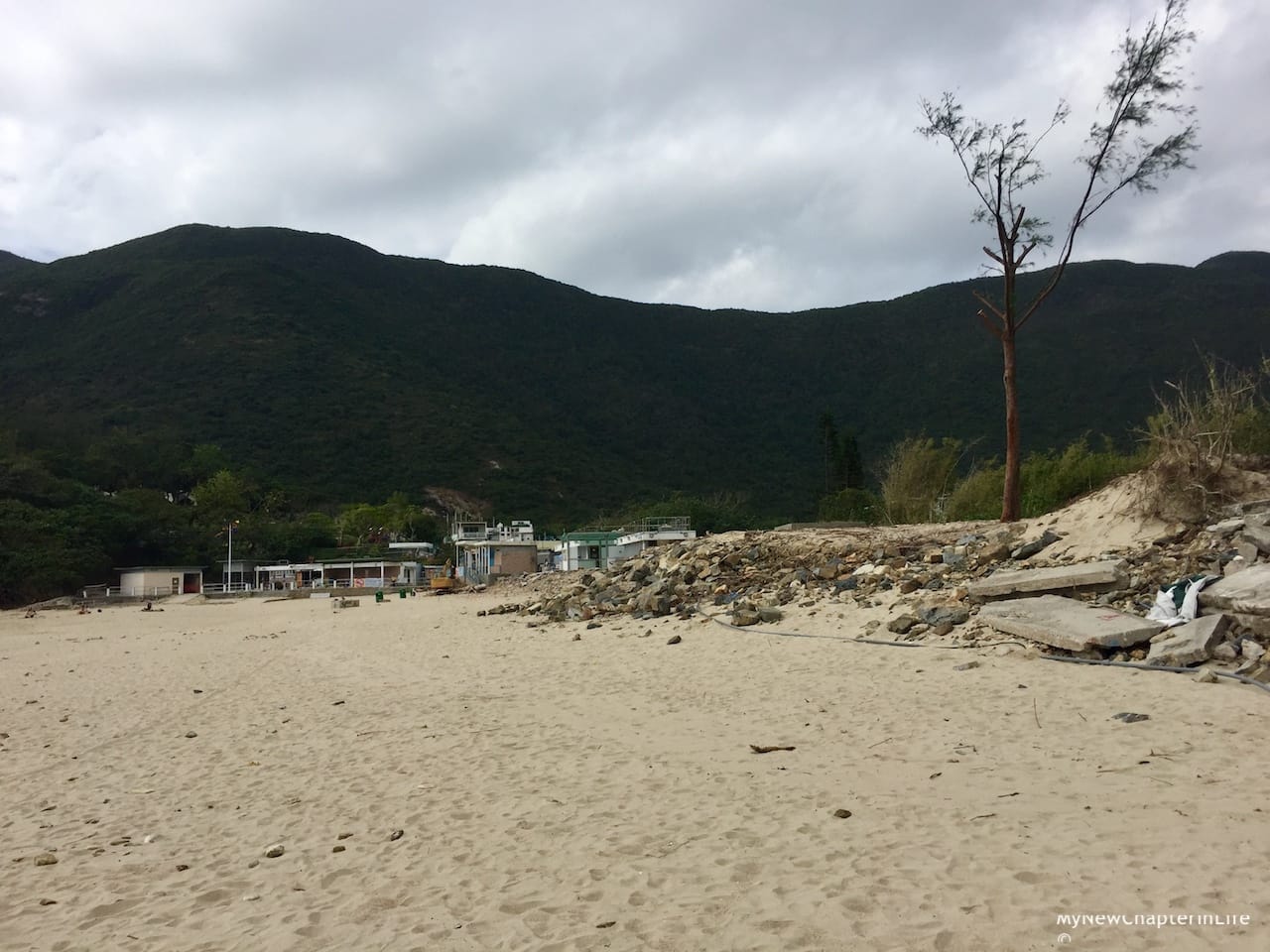 Debris and concrete building structures were piled up at the end of beach